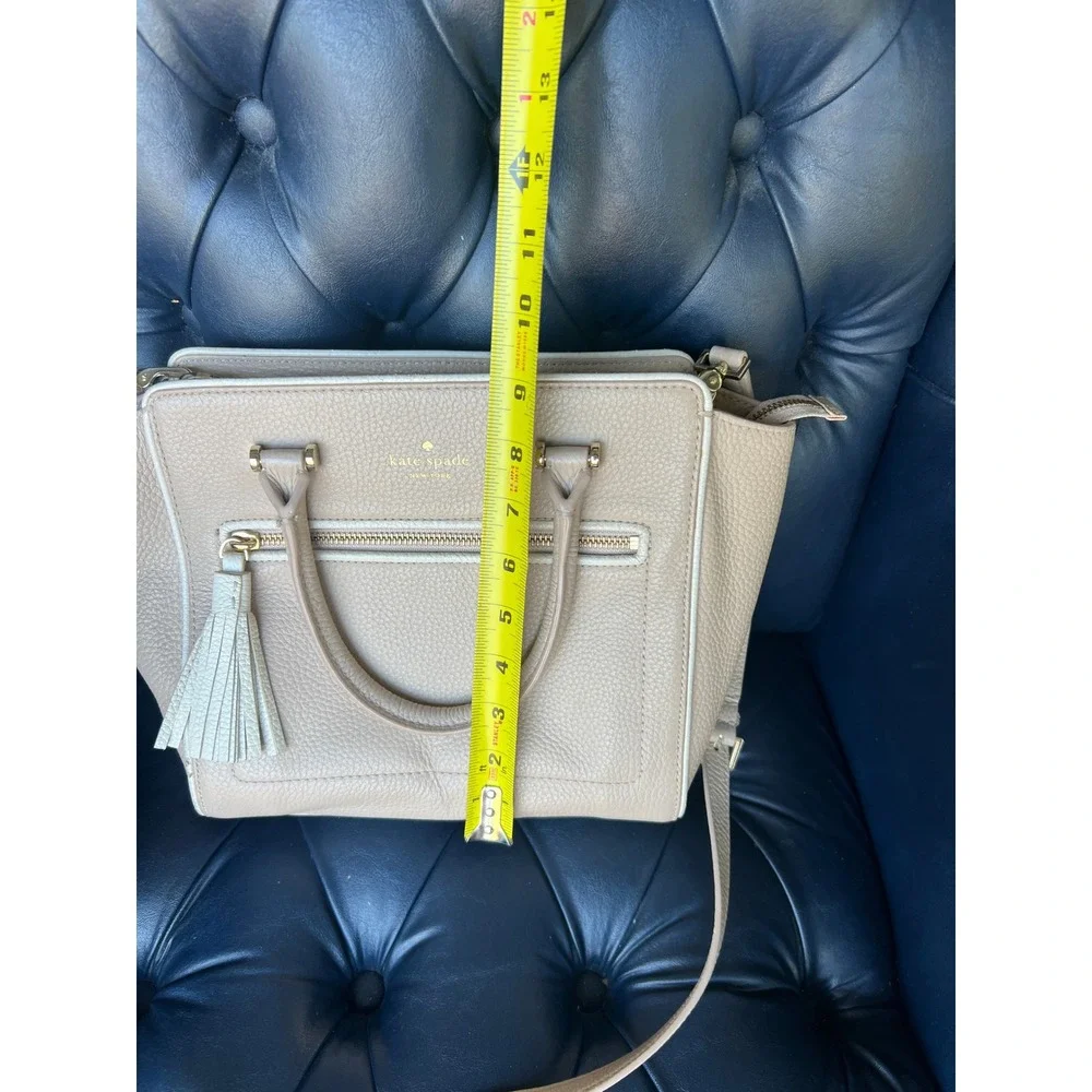 Kate Spade New York Beige Pebbled Leather Tassel Satchel Crossbody Bag PXRU6016